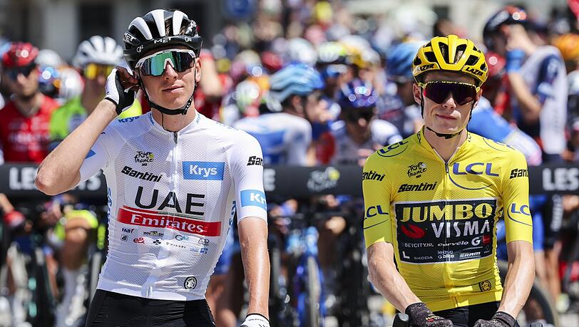 Tadej Pogacar (l) ist der große Favorit für die Tour de France. Ob Titelverteidiger Jonas Vingegaard (r) bei der Frankreich-Rundfahrt am Start ist, steht noch nicht fest.