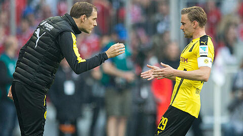 Hatten in der Allianz Arena erhöhten Redebedarf: Dortmunds Trainer Thomas Tucel (links) und BVB-Kapitän Marcel Schmelzer.