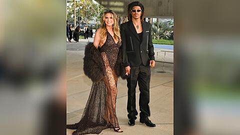 Heidi Klum strahlt mit ihrem Sohn Henry in die Kamera.