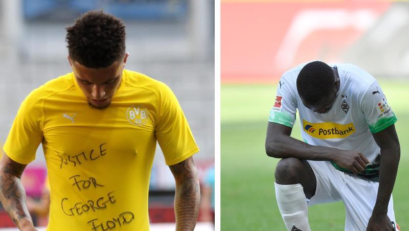 Dortmunds Jadon Sancho (l) trägt ein Trikot mit der Aufschrift "Justice for George Floyd", Der Gladbacher Marcus Thuram kniet auf dem Rasen. Dortmunds Jadon Sancho (l) trägt ein Trikot mit der Aufschrift "Justice for George Floyd", Der Gladbacher Marcus Thuram kniet auf dem Rasen.