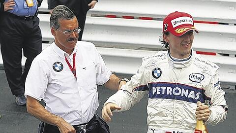 &bdquo;Wenn sich die Chance bietet, werden wir zuschlagen&ldquo;: BMW-Motorsportchef Theissen und sein Spitzenfahrer Kubica haben Geschmack am Erfolg (und am Sieger-Schampus) gefunden.