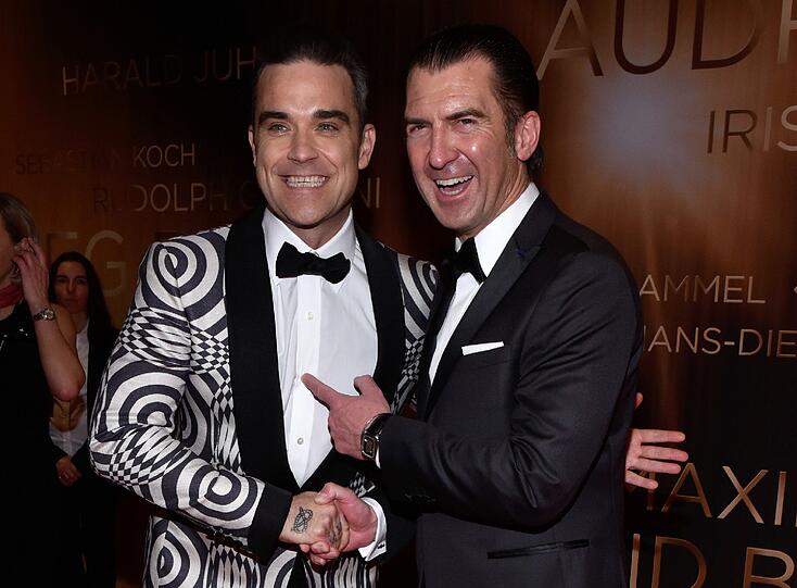 Robbie Williams (l) und Philipp Welte