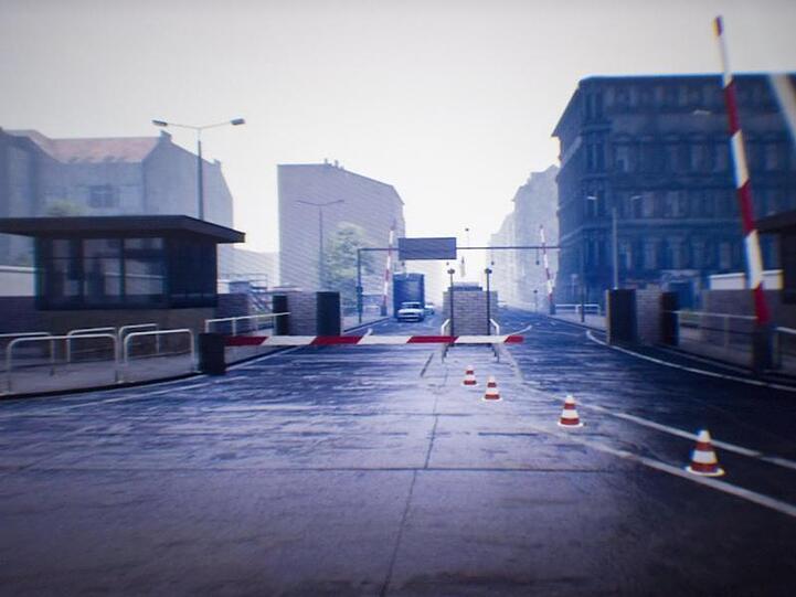 Ein Grenzübergang ist bei einer virtuellen Zeitreise in das geteilte Berlin in einer Virtual-Reality-Brille zu sehen.