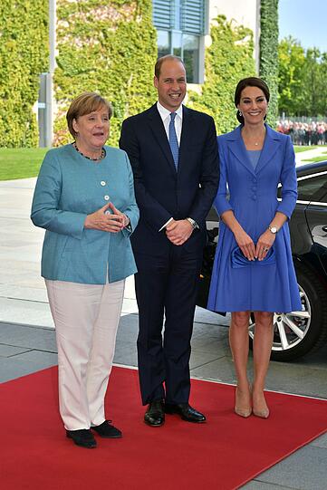 Lächeln für die Fotografen: Angela Merkel mit Prinz William und Herzogin Kate
