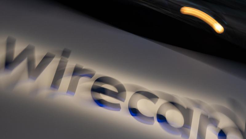 Ein Schild mit der Aufschrift "wirecard". Foto: Peter Kneffel/dpa