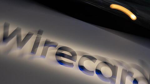 Ein Schild mit der Aufschrift "wirecard". Foto: Peter Kneffel/dpa