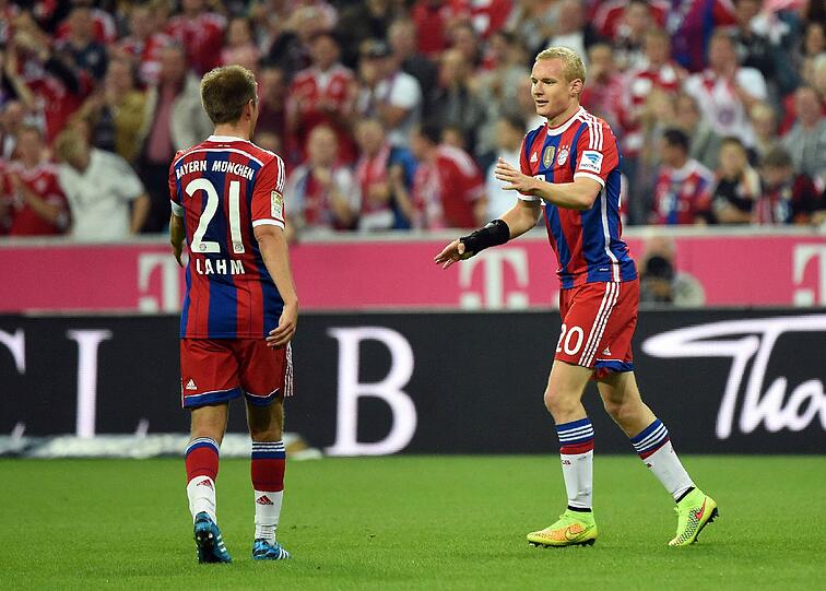 Für eine Vereinfachung der momentan recht komplizierten Handspiel-Regelung: Die Bayern-Stars Philipp Lahm und Sebastian Rode.