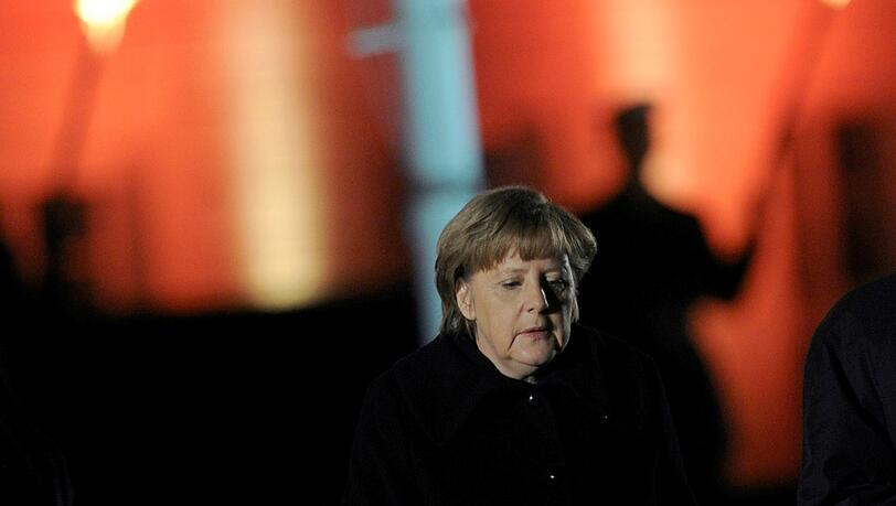 Bundeskanzlerin Angela Merkel (CDU) bei einem früheren Zapfenstreich, mit dem Christian Wulff verabschiedet wurde.