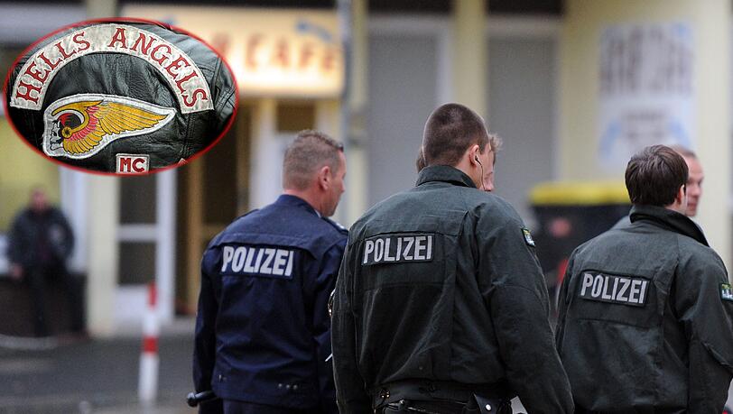 Polizisten gehen am 21.05.2013 in Mülheim an der Ruhr (Nordrhein-Westfalen) am Star Cafe, einem Rocker-Treffpunkt, vorbei. Die Polizei will erneute Auseinandersetzungen zwischen Rockerbanden vorbeugen und reagiert mit einem Großeinsatz. Polizisten gehen am 21.05.2013 in Mülheim an der Ruhr (Nordrhein-Westfalen) am Star Cafe, einem Rocker-Treffpunkt, vorbei. Die Polizei will erneute Auseinandersetzungen zwischen Rockerbanden vorbeugen und reagiert mit einem Großeinsatz.