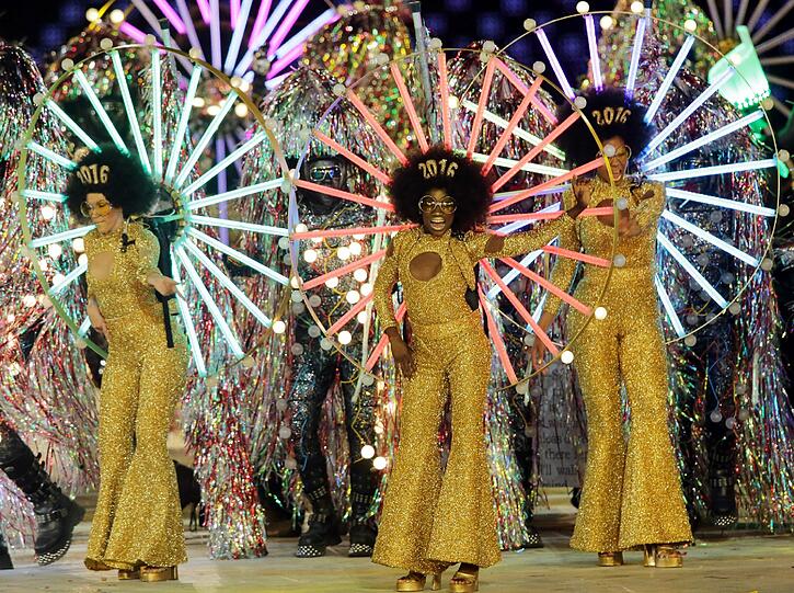 Bei der gigantischen Abschlussfeier der Olympischen Spiele in London heizten Rock- und Popstars wie Queen, George Michael, die Spice Girls und The Who Publikum und Sportlern ein.