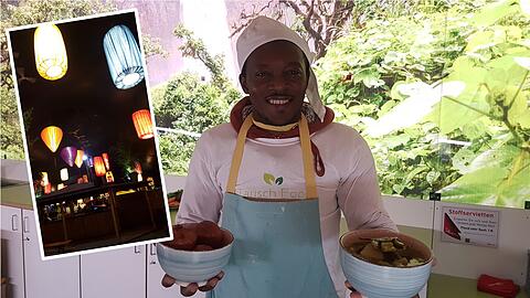 Aristide Charlie Tcheuko Towo mit Krapfen und Eintopf.