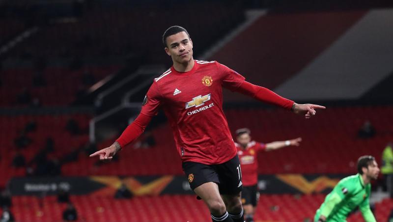 Manchester Uniteds Mason Greenwood freut sich über das sechste Tor im Spiel gegen AS Rom. Manchester Uniteds Mason Greenwood freut sich über das sechste Tor im Spiel gegen AS Rom.